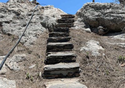 Image shows steep rock stairs leading to the fire lookout station.
