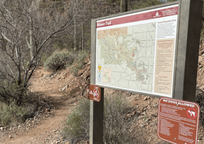 Image shows a sign at Starr Pass Resort that directs hikers toward the Bowen Trailhead.
