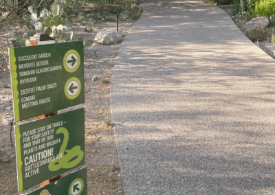 Image of a sign providing directions to three points of interest.