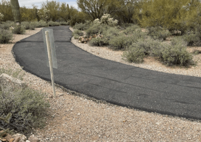 Image of a paved road at the start of the trail.