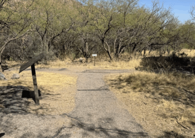 Image of the trail head for both trails, with the Accessible Trail to the right and the Nature Trail to the Left.