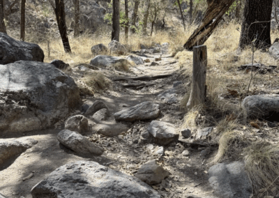 Image of large rocks and boulders on the rugged natural surface of the Nature Trail.