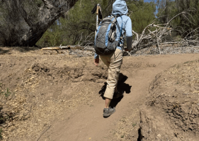Image of a hiker walking up a slope that is greater than 8 degrees.